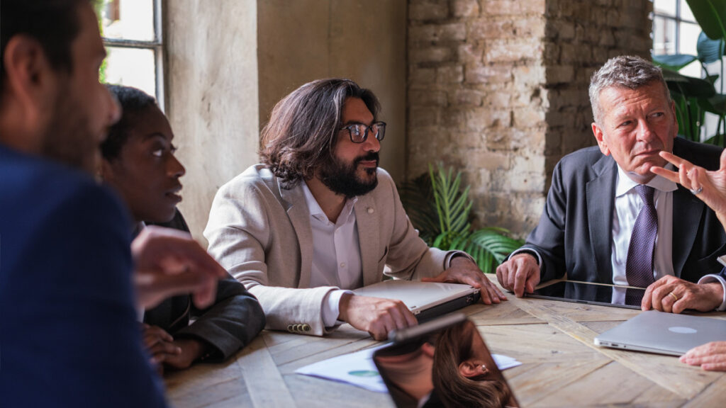 Meeting of businessmen from different parts of the world in a coworking space