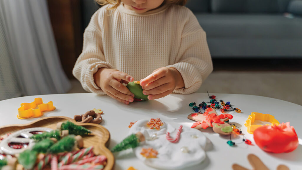 A child playing with Play-Doh