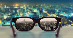 A view of a modern city with it's former look in glasses