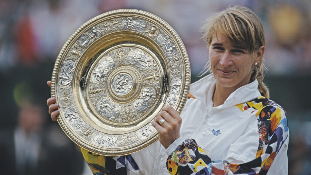 Steffi Graf holds aloft the Venus Rosewater Dish after defeating Jana Novotna at Wimbledon in 1993