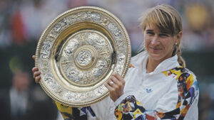 Steffi Graf holds aloft the Venus Rosewater Dish after defeating Jana Novotna at Wimbledon in 1993